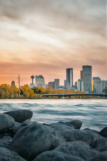 Cityscape of downtown Calgary with Bow River in the foreground